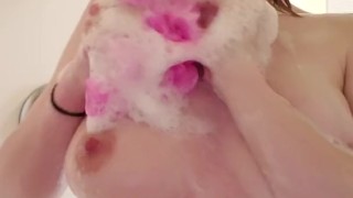 Teen soaps up tits in shower, finishes on floor