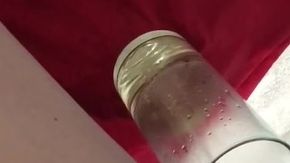Norma over flows a vase with pee