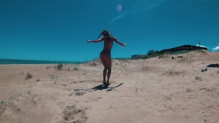 Awesome nudist girl have fun on a public beach in Valencia. Naked Outdoors