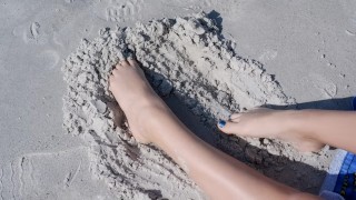 Sandy teen feet at the beach