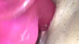 Pink dildo in wet pussy