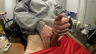 Jerking off in red shorts