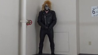 masked leather man quickly shoots his load in hotel stairway