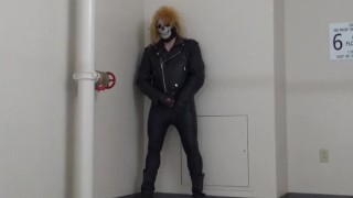 masked leather man quickly shoots his load in hotel stairway