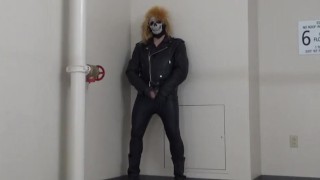 masked leather man quickly shoots his load in hotel stairway