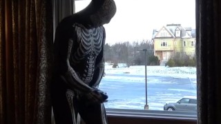 Dawn of the dead morphsuit in window cums into black rubber cock extender