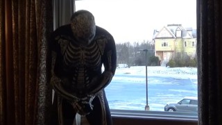 Dawn of the dead morphsuit in window cums into black rubber cock extender