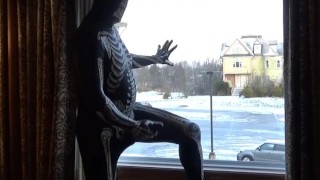 Dawn of the dead morphsuit in window cums into black rubber cock extender
