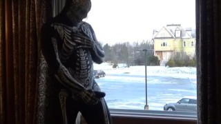 Dawn of the dead morphsuit in window cums into black rubber cock extender