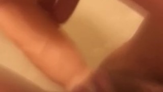 Teasing my pussy with my dildo in the tub