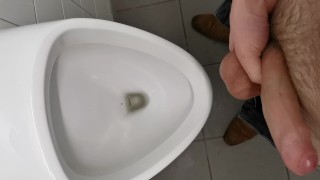 Horny uncut teen jerking and cumming at public school urinal