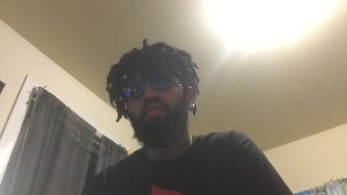 Young male sits and stares at you