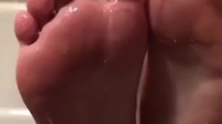 Smooth oiled feet play