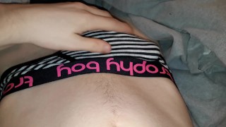 Twink plays with dick through briefs in bed