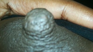 erect ebony nipples close-up