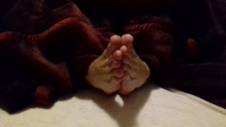 Lubed feet and soles rubbing each other - spreading toes