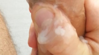 Teen plays with his foreskin and cum