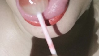 Horny chubby girl licking lollipop