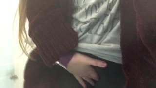 College Girl Touches Herself Over Pants in Public Restroom