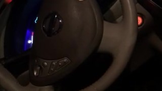 Stroking soft white cock in electric car POV