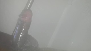 Thick black dick jerks off under water