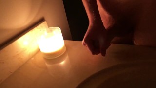 I masterbate by candlelight then cum on the counter