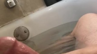 White Cock stroking in the bath tub with baby oil POV