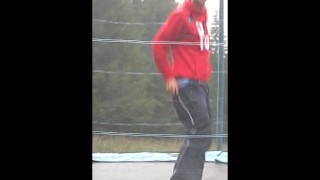 Teen shows his big cock for fun on a trampoline at the camp