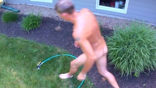 Outdoor garden shower drone filmed hose out