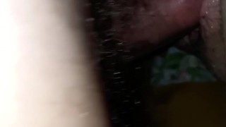 Strap-on and dick penetrate pussy at the same time.