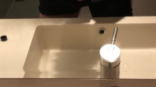 Blasting a load on hotel mirror