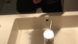 Blasting a load on hotel mirror