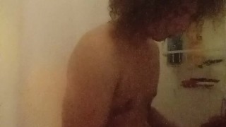Fingering ass and stroking in shower