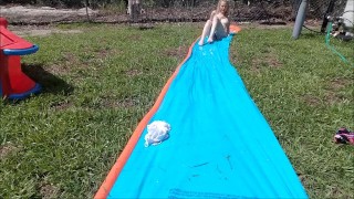 Blonde does Slip n Slide Naked in her backyard & masturbates