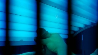 Watch me tense up as i cum on myself in this tanning bed
