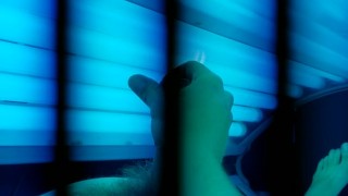 Watch me tense up as i cum on myself in this tanning bed