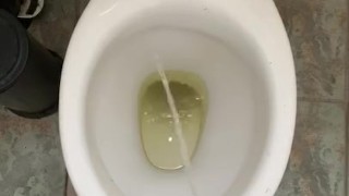 Pissing at home in red and white socks