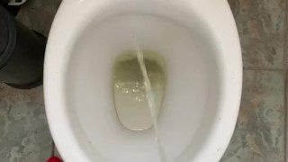 Pissing at home in red and white socks