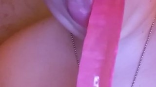 Sexy Bitch sucks off pink dildo