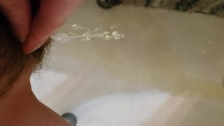 Disabled woman pees in the tub wearing knee socks