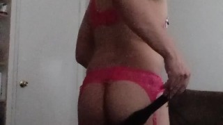Crossdresser in pink lingerie sucks dildo then cums