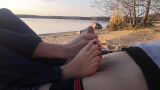 public footjob and socksjob on the beach