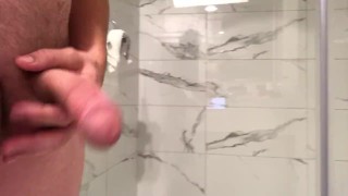 Soft cock and balls stroking in hotel bathroom