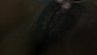 Ebony teen plays with her wet pussy