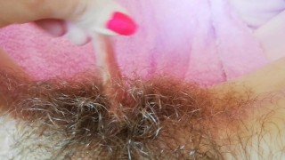 Playing with my big clit hood pulling and stretching hairy bush pussy close