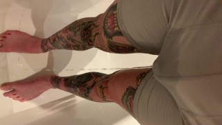 Tattooed guy wetting boxers