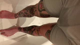 Tattooed guy wetting boxers