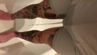 Tattooed guy wetting boxers