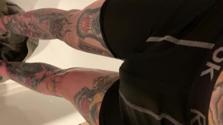 Tattooed guy desperate wetting taking off shorts and boxers