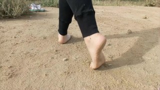 Super slow motion feet walking on dusty ground -- DIRTY FEET